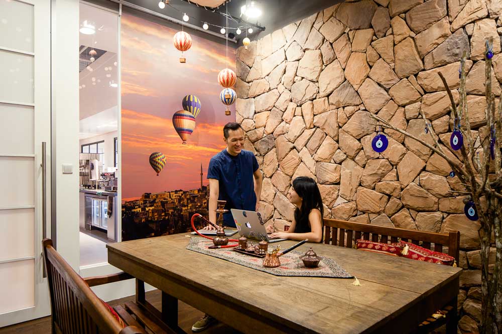 People in Cappadocia Room at Airbnb's Singapore Office