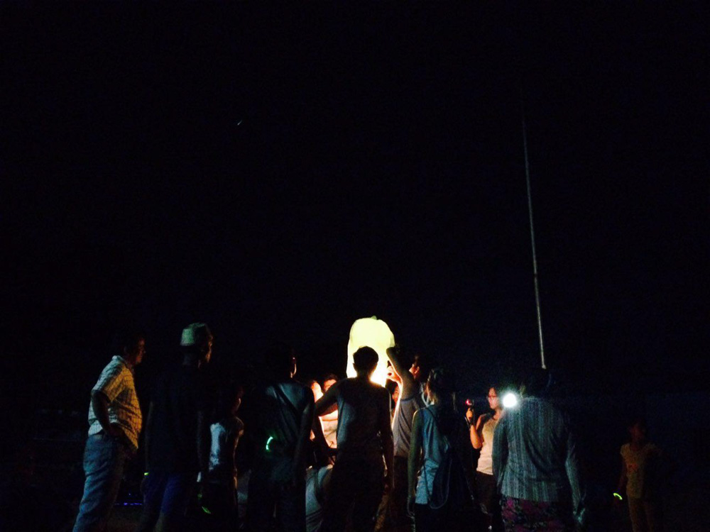 Lighting a lantern - Volunteering Abroad