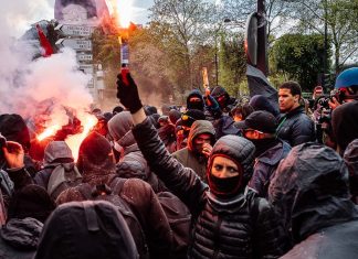 Young Singaporean travels to work with rioters and refugees around the world Riots cover image - travel photojournailsm paris france protests