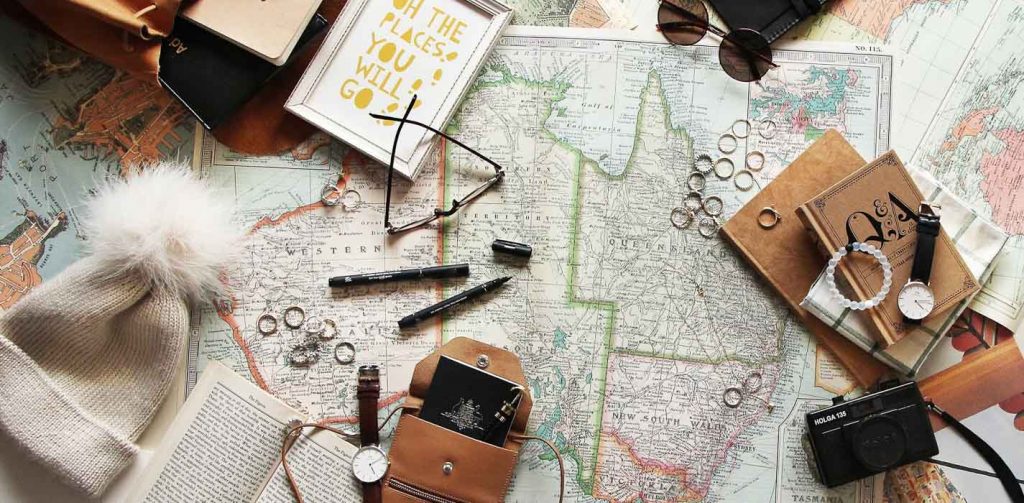 World map flat lay - Travel budget gap year