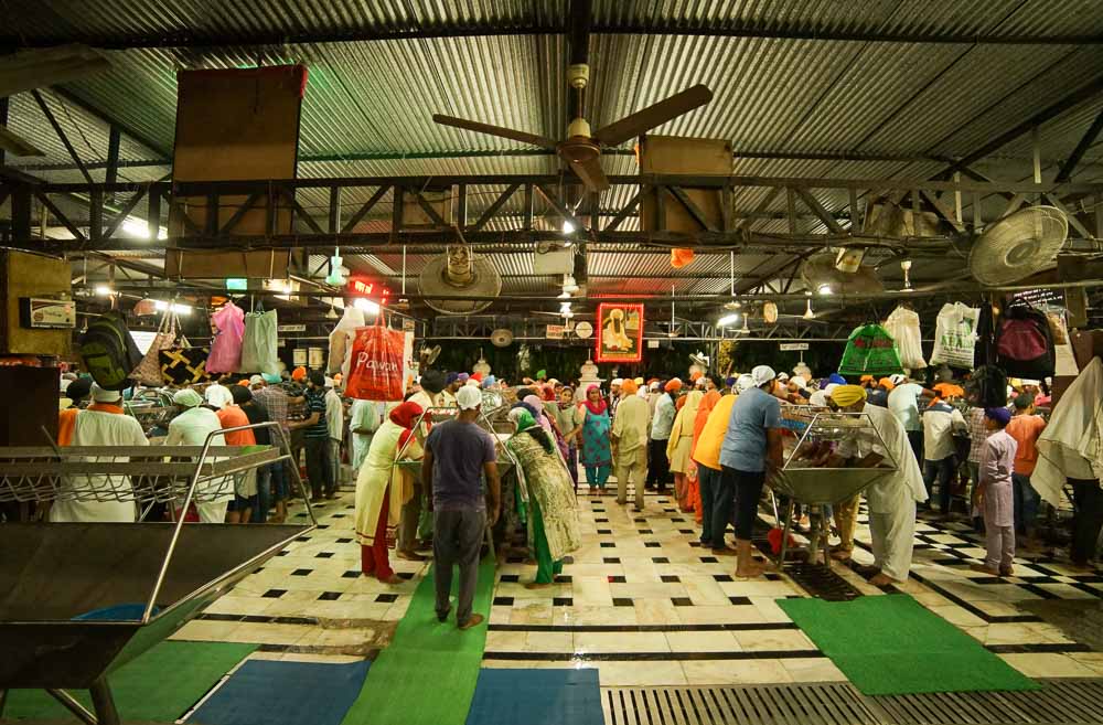 Amritsar - Washing plates at the Golden Temple food kitchen