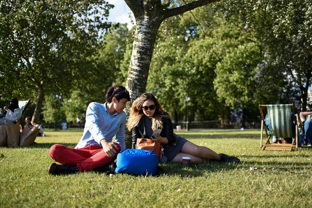 Hyde Park resting and playing Pokemon GO-1