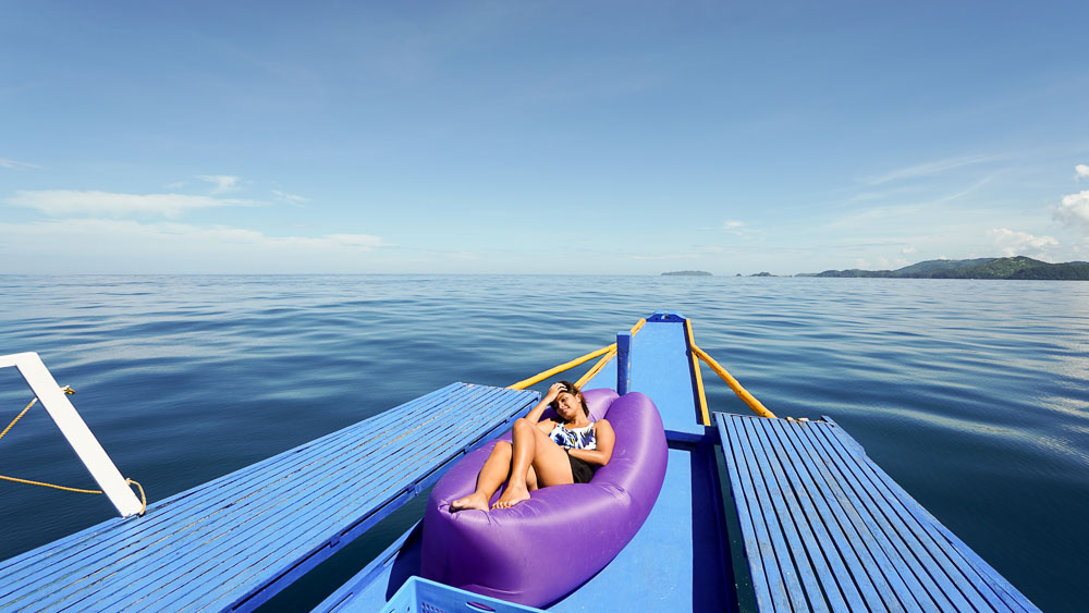 suntanning-on-boat-tao-philippines-expedition