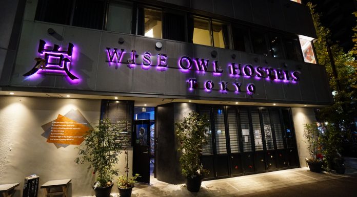 Entrance of Wise Owl Hostels Tokyo at night - featured image wise owl hostels tokyo review