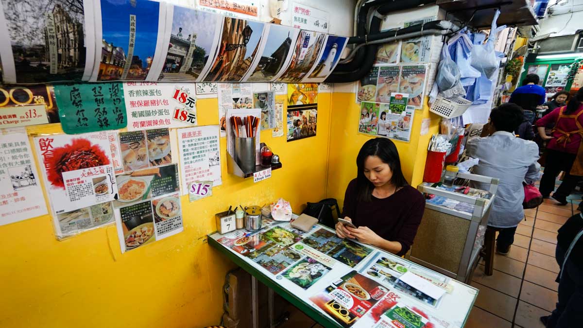 Cherie figuring out what would be the best to order at Chopsticks Kee - hong kong food journey 6