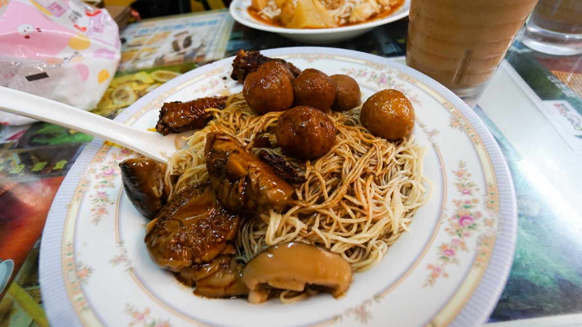 dry noodles, curry fishballs, mushrooms, and soy sauce chicken - hong kong food journey 8