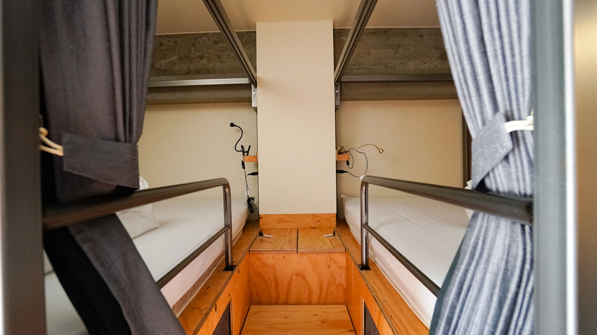 Bedside lockers, reading lights, and blackout curtains at bunk beds - wise owl hostels tokyo review 14