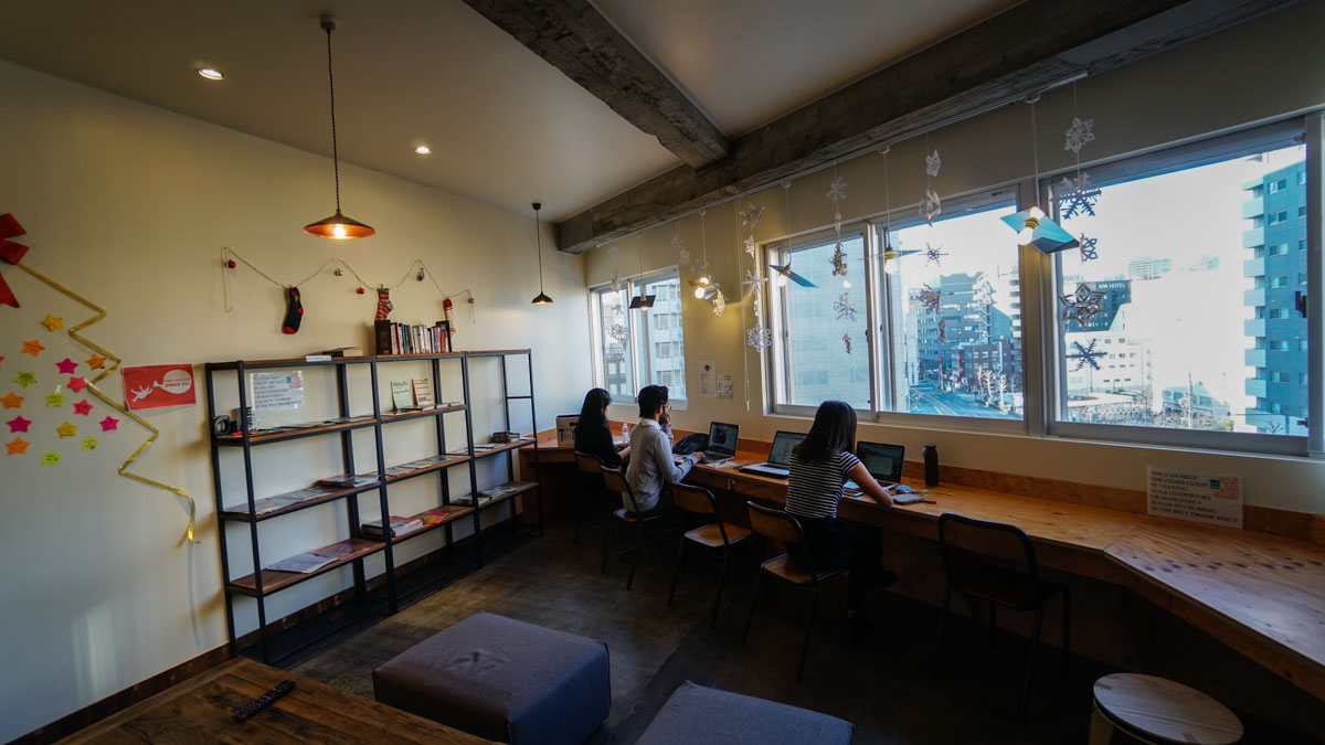 The Travel Intern team working in the common room - wise owl hostels tokyo review 4