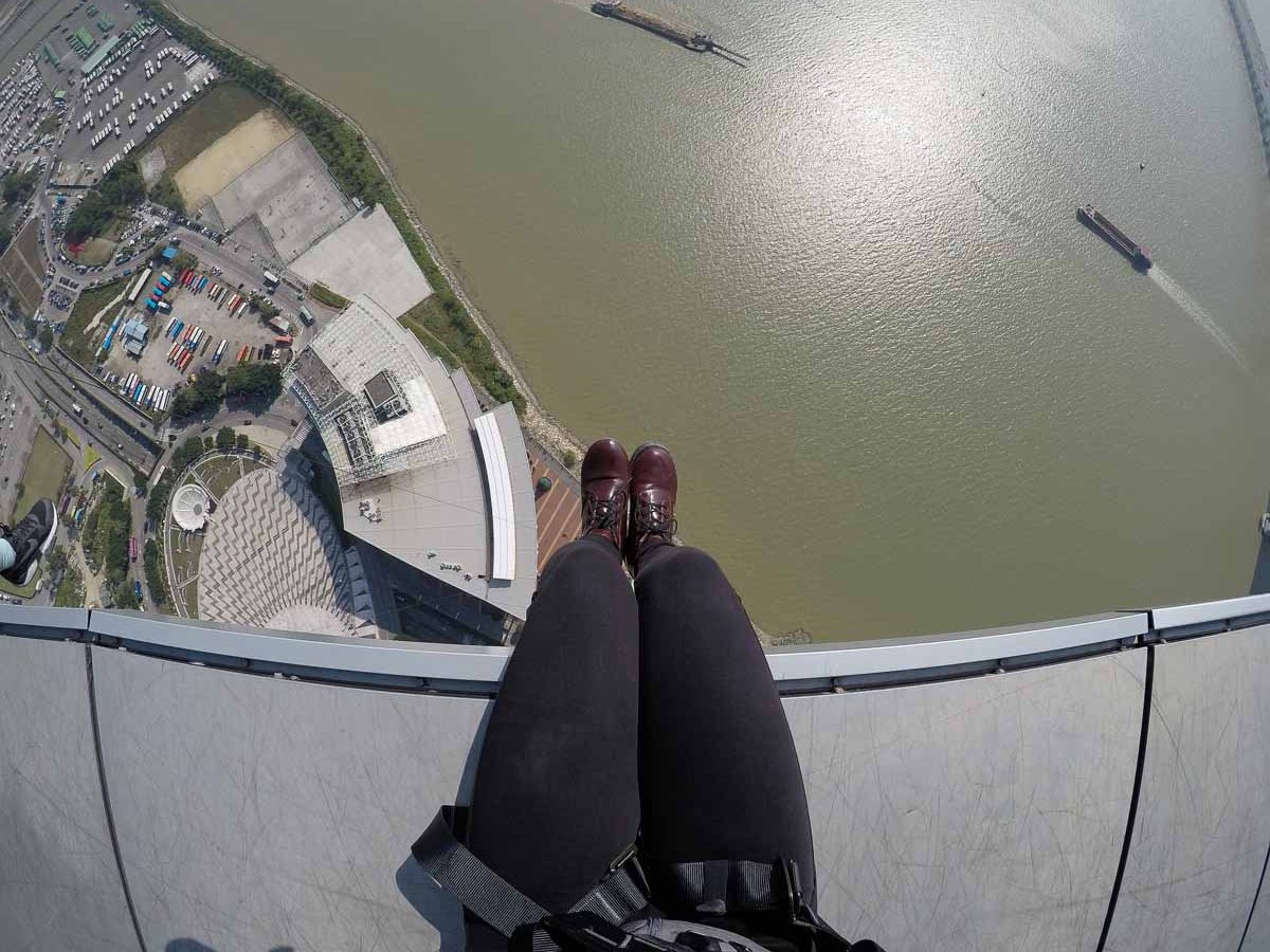 Sitting on the edge of Macau Tower-Bungy