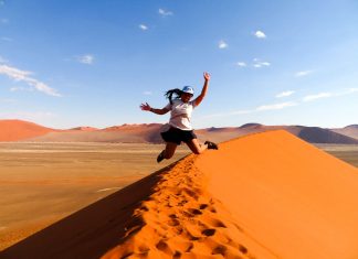 How I managed to convince myself and everyone else I could travel solo for a year Jumping for joy at Dune, Namibia - travel solo for a year