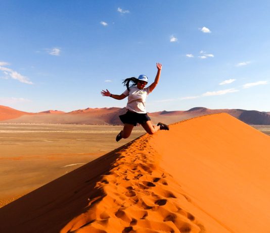 Jumping for joy at Dune, Namibia - travel solo for a year