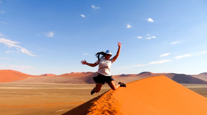 Jumping for joy at Dune, Namibia - travel solo for a year