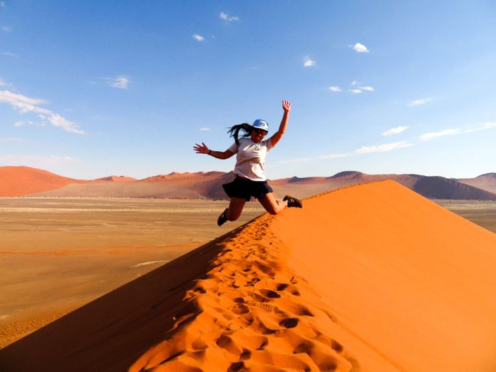 Featured - travel solo for a year-8 Jumping for joy at Dune, Namibia - travel solo for a year