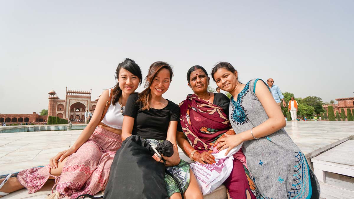 Taking a photo with the locals at Taj mahal - First timers guide to India