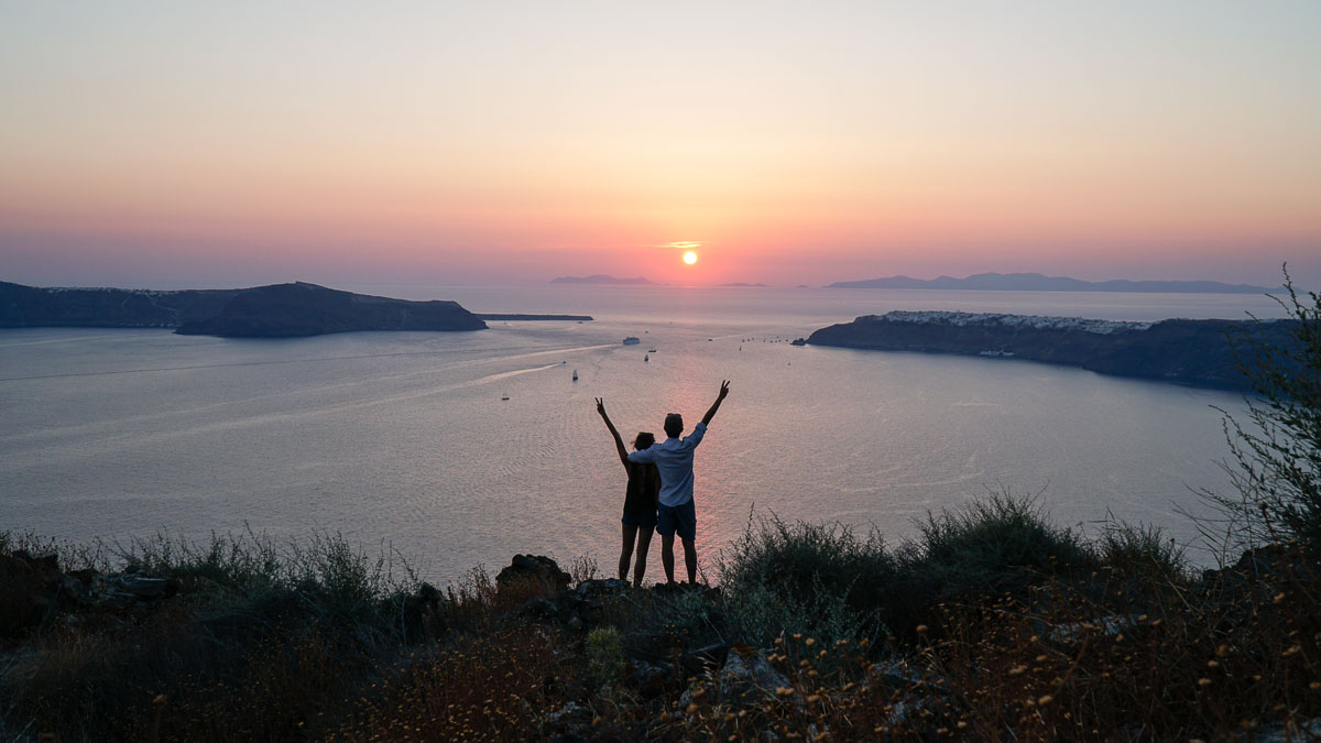 Sunset on Skaros Rock in Santorini, Greece - Europe Itinerary Backpacking on Budget