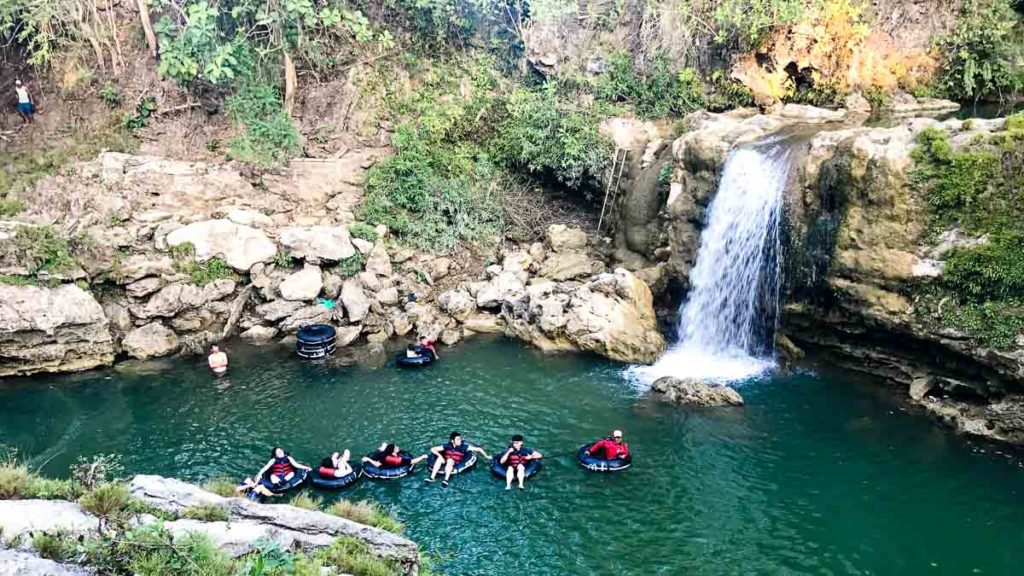 Goa Pindul people on rubber tubes in river - Yogyakarta Itinerary