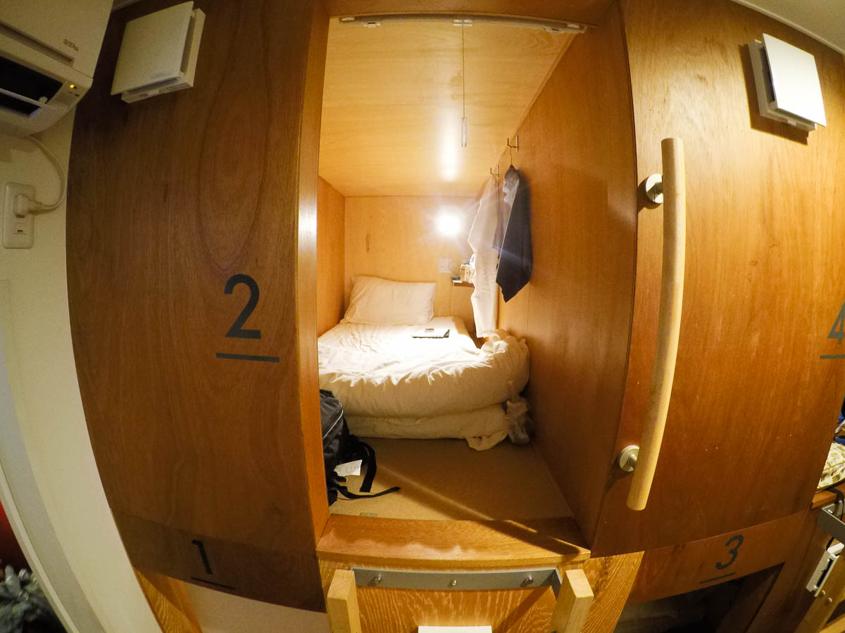 Capsule bed at Nagoya Nishiasahi Restaurant and Guesthouse - Backpacking in Japan Itinerary with the JR Pass