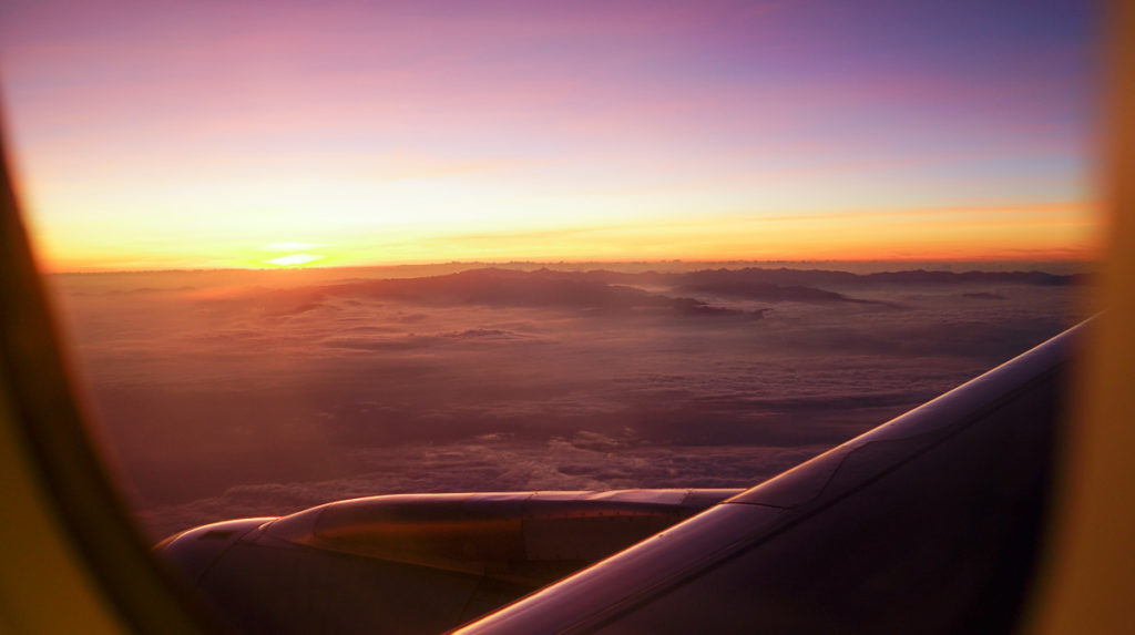 Sunset on plane - Singapore Travel Rules