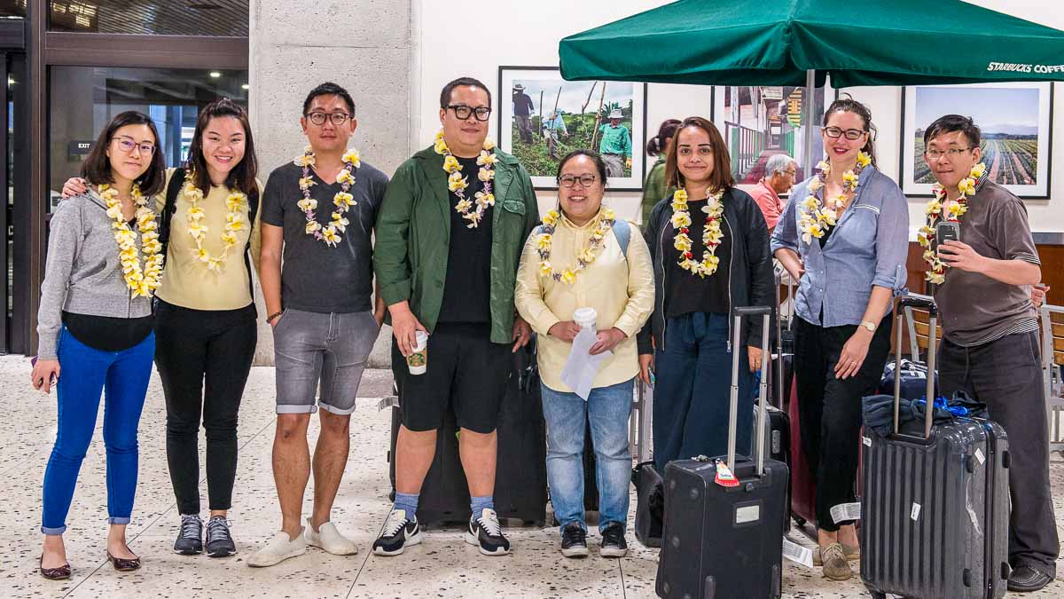 Group picture with lei garlands - Things to do in Honolulu