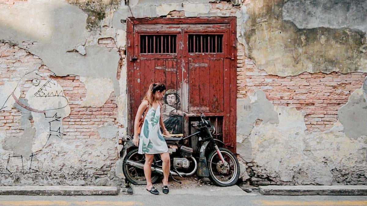 Boy on a bike street art penang - Cruise Penang Day Trip