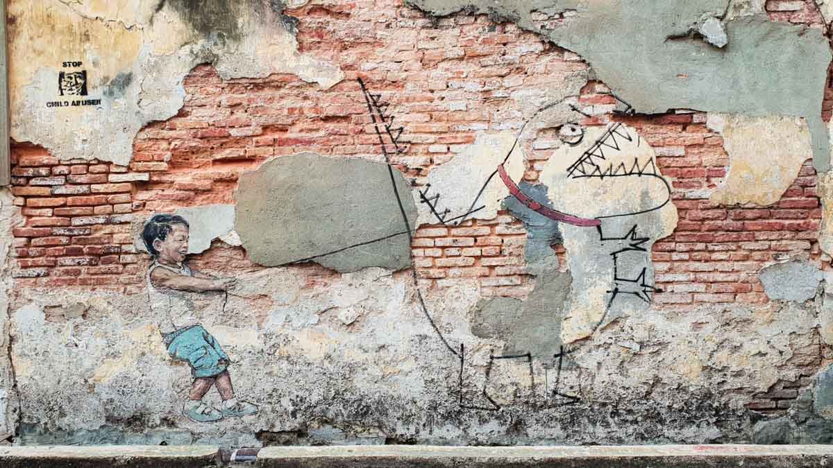 Street Art Ah Quee Street boy with pet dino - Cruise Penang Day Trip Guide