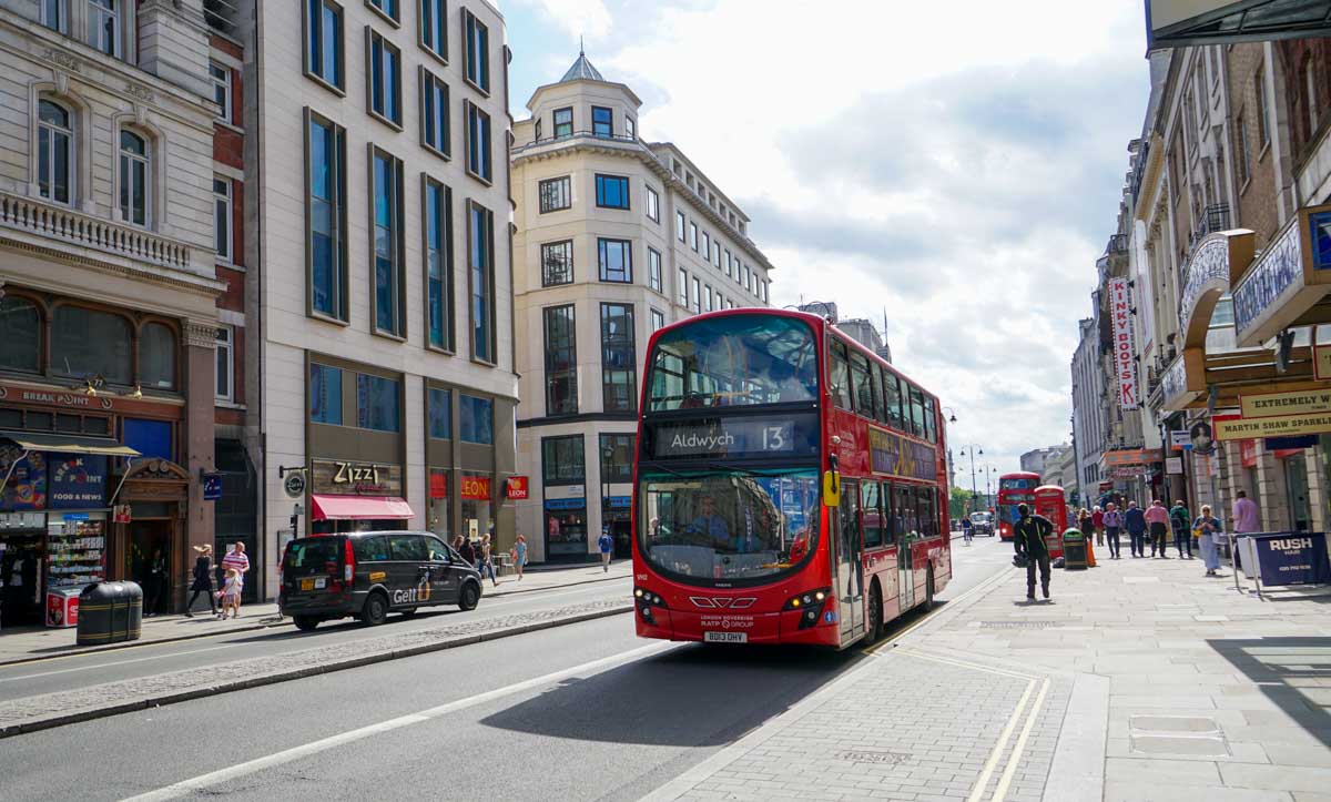 Streets of London and the iconic red bus - Europe Itinerary Backpacking on Budget