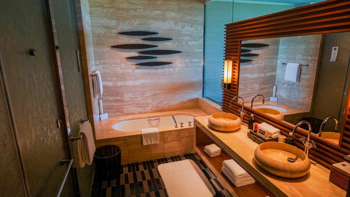 Marble Bathroom with Bathtub and Private Walk-in Shower in Raffles Hainan Ocean View Room - Raffles Hainan Hotel Review