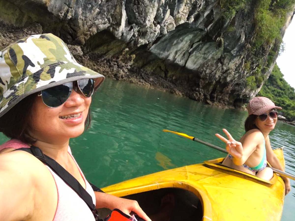 Merine Canoeing in Halong Bay with her sister - 58-year-old Singaporean Solo Backpacker