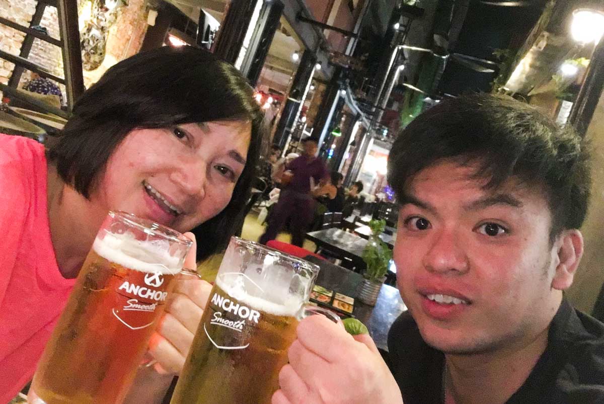 Merine having drinks with a friend she made in Cambodia - 58-year-old Singaporean Solo Backpacker