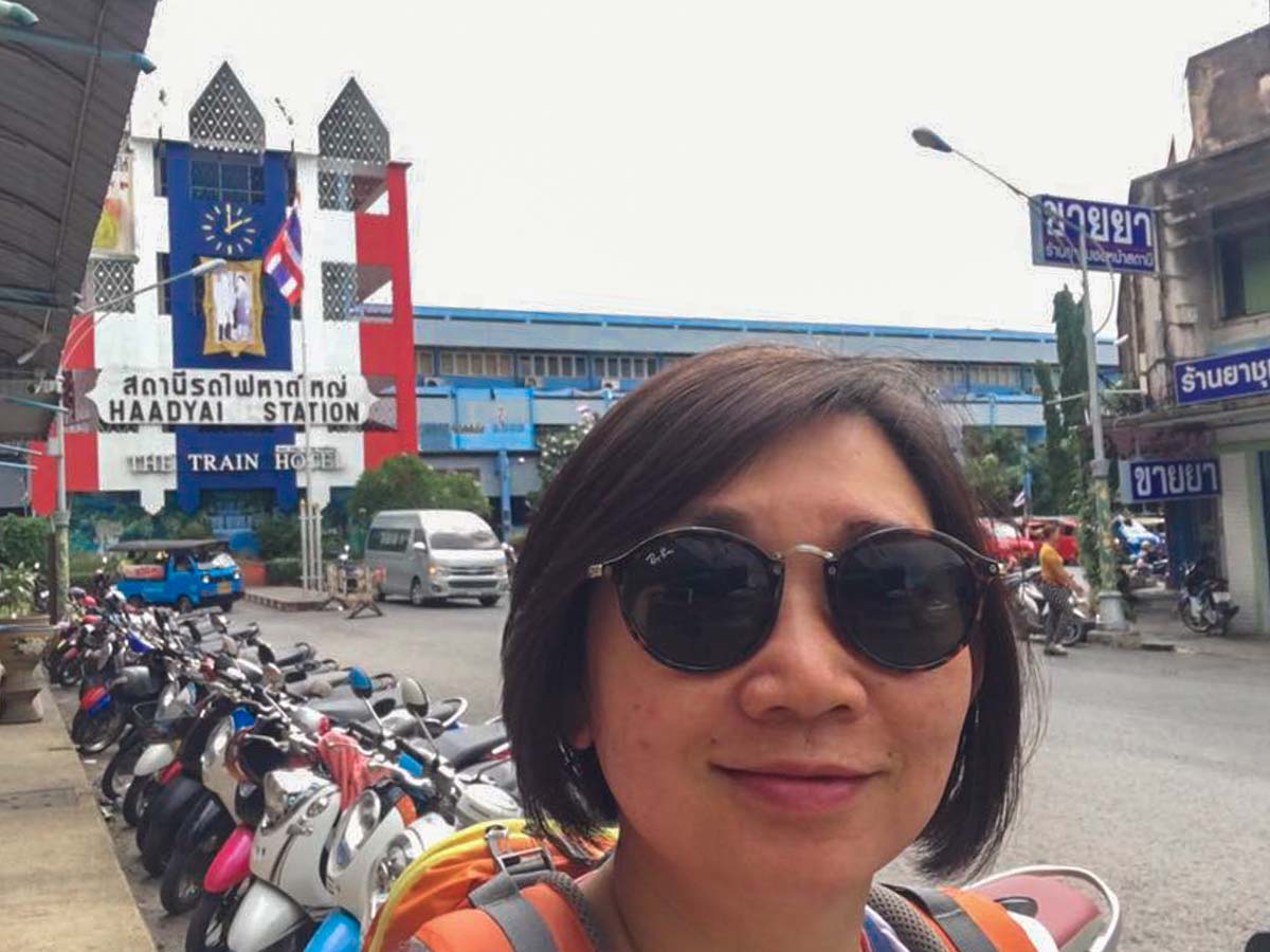 Merine outside of Hat Yai train station - 58-year-old Singaporean Solo Backpacker