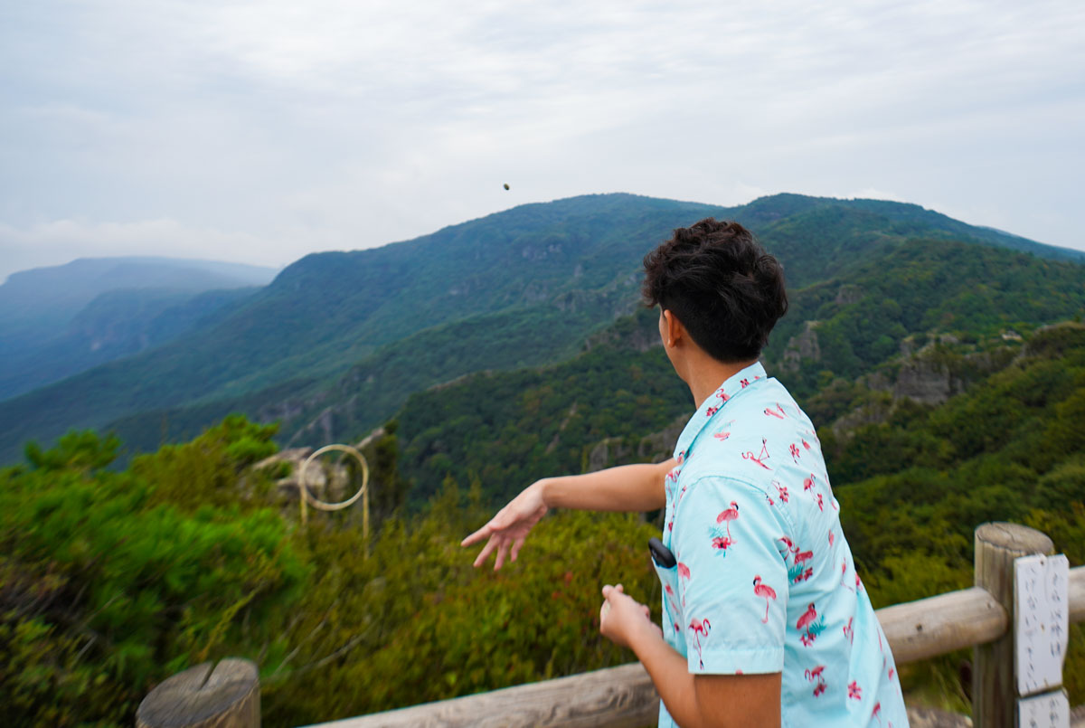 Throwing Kawarake atop the Shodoshima Kankakei Ropeway - Unique Experiences in Shikoku Japan
