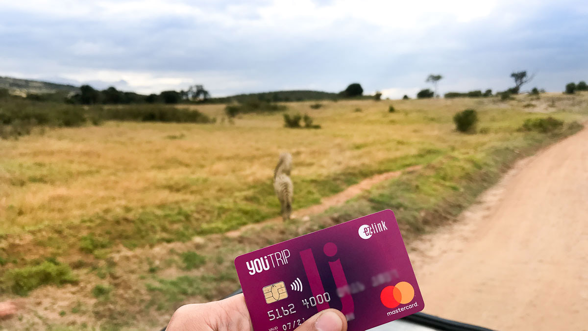 Holding the YouTrip Card in Maasai Mara Kenya---YouTrip Review2