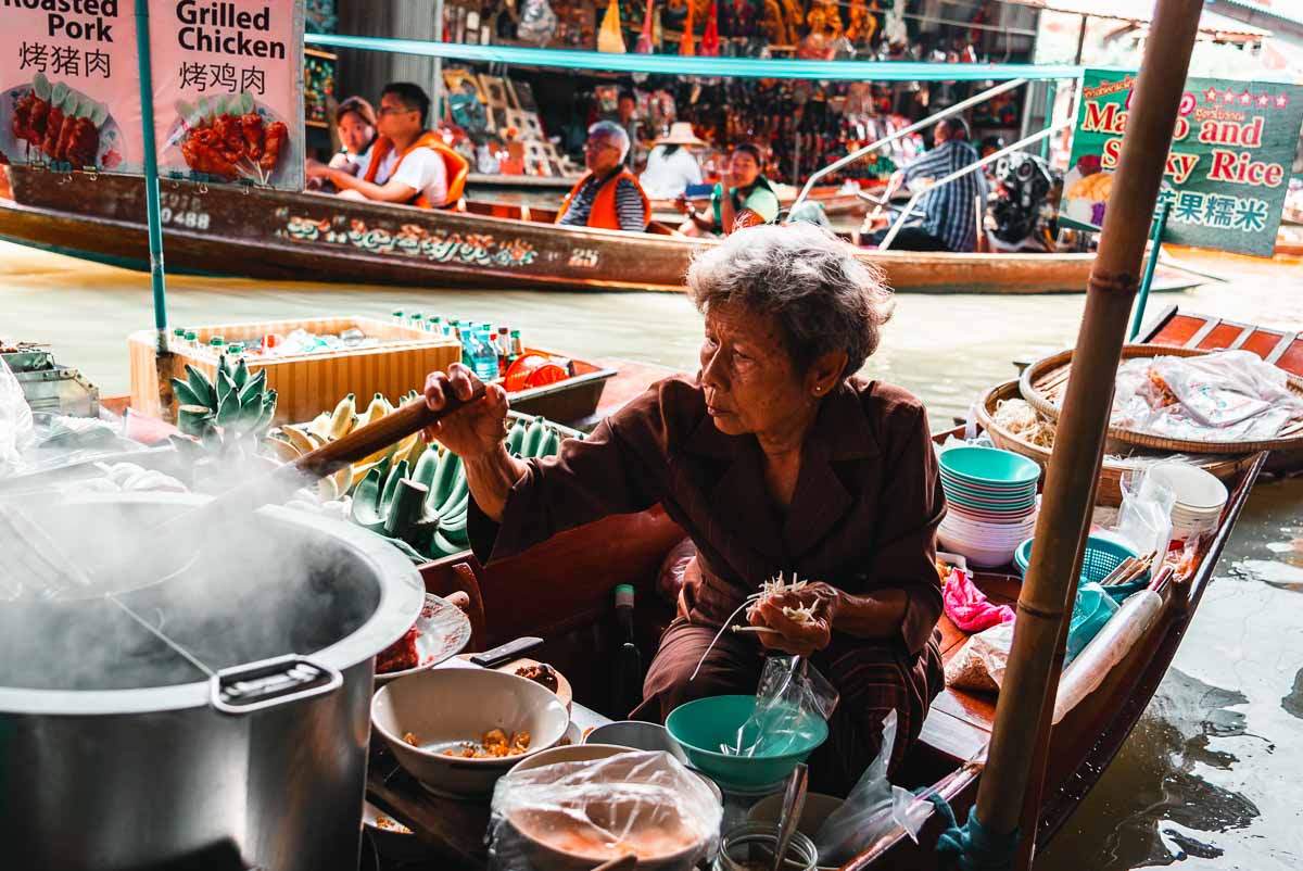 Old Lady Selling Boat Noodles on Long Tail Boat at Damnoen Saduak Floating Market - Bangkok Itinerary