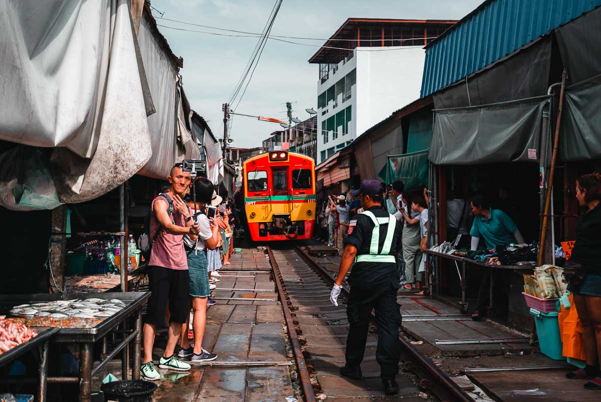 Train Passing Through Maeklong Railway Market - Bangkok Itinerary
