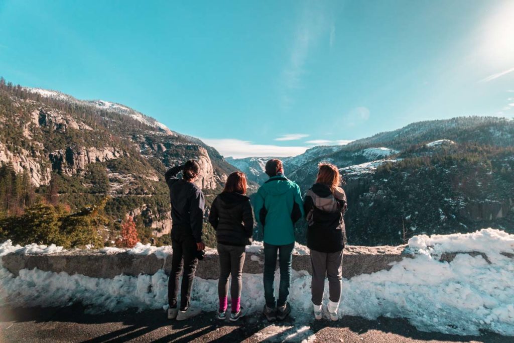 Four Friends Looking Out at Yosemite National Park - SF to LA Road Trip Itinerary