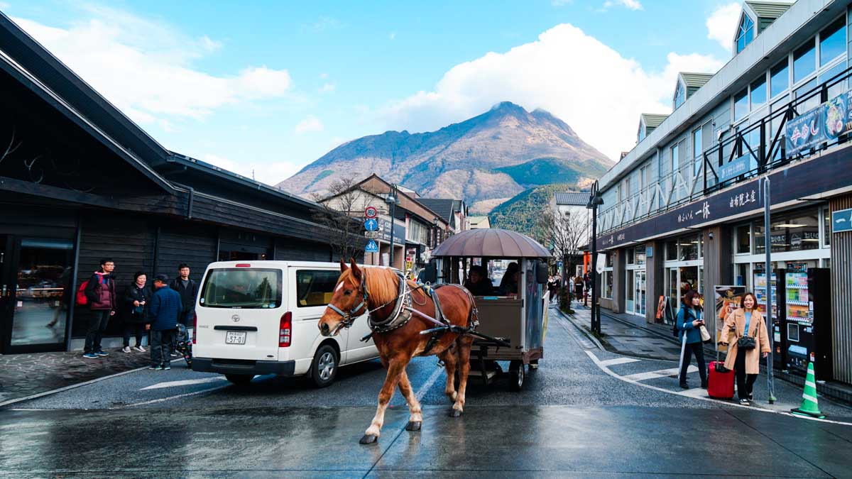 Yufuin main street with horse carriage - Japan Kyushu Itinerary
