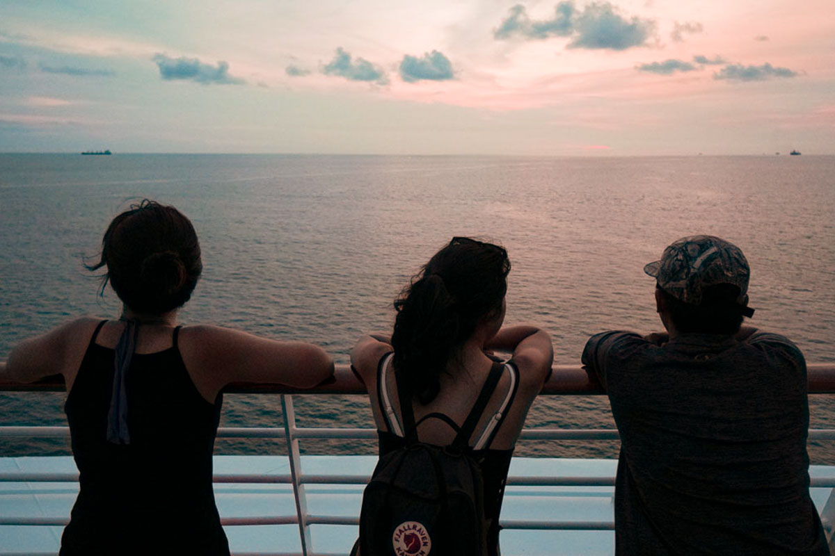 Group of People Looking Out to Sea from Cruise Ship - SSEAYP Youth Exchange
