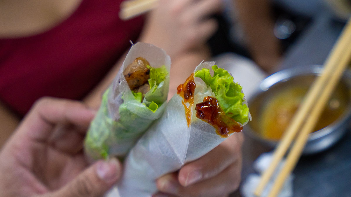 grilled pork and veggies in  rice rolls from Con Market - Central Vietnam Itinerary