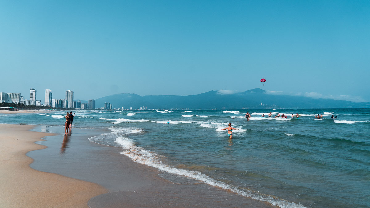 Beachgoers at My Khe Beach - Central Vietnam Itinerary