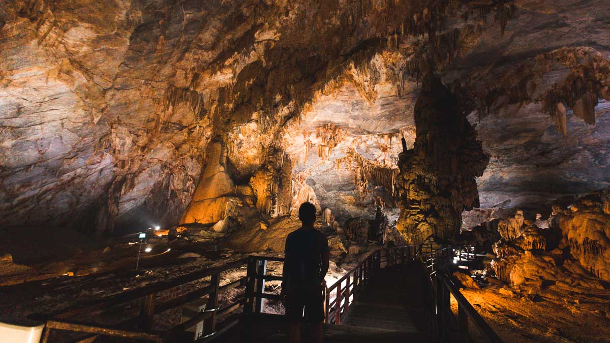 Man standing on bridge in Phong Nha Cave 2 - Central Vietnam Itinerary