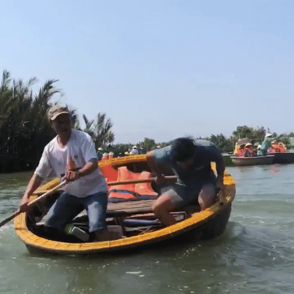 2 men in a Spinning Basket Boat - Central Vietnam Itinerary