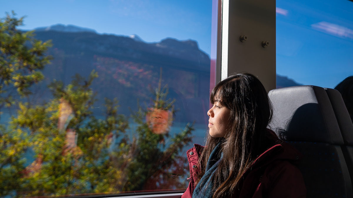 Looking out Train Rail Window in Switzerland - Europe Itinerary Backpacking on Budget