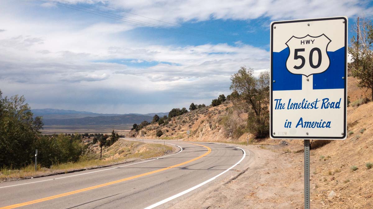 Road sign of the Loneliest Road Route 50 - USA road trip