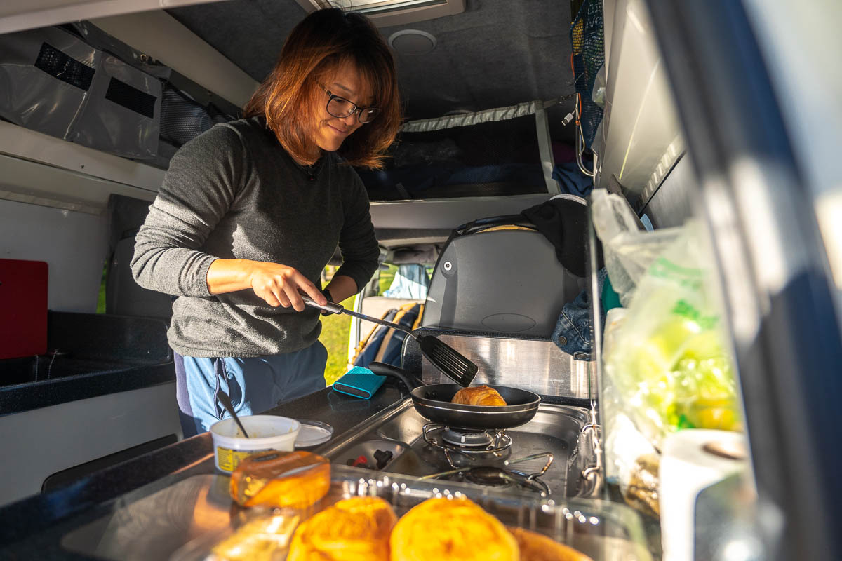 Toasting Croissants on Campervan Frying Pan - New Zealand Itinerary North Island