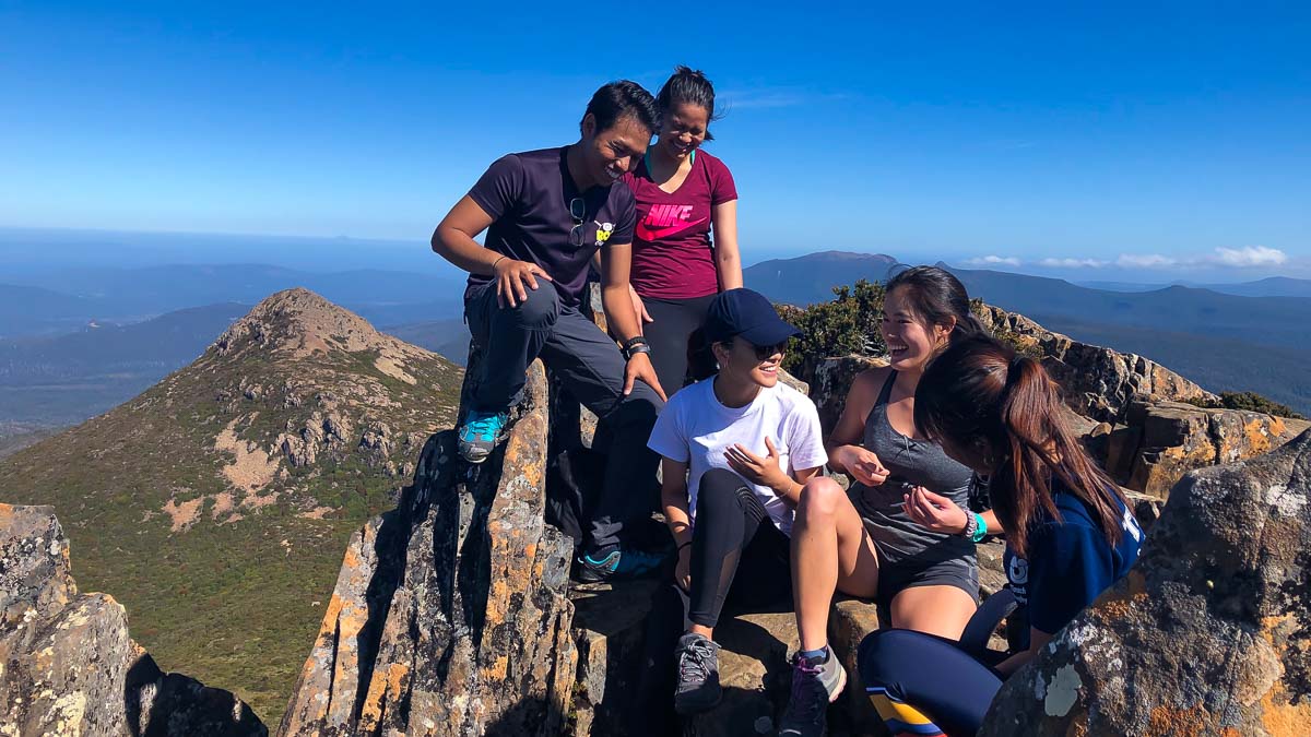 With friends on Mount Anne - Solo Travel Guide