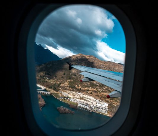 Airplane Window View - Travel Reopening Timeline