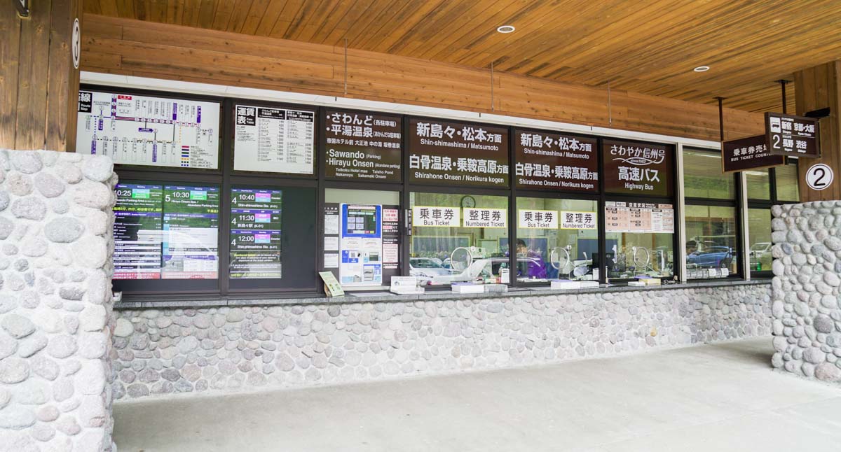 Bus Numbered Ticket Counter for Alpico Buses to Shirahone Onsen and Norikura Highlands at Kamikochi Bus Terminal - Nagano Itinerary for Couples Kamikochi Norikura Matsumoto