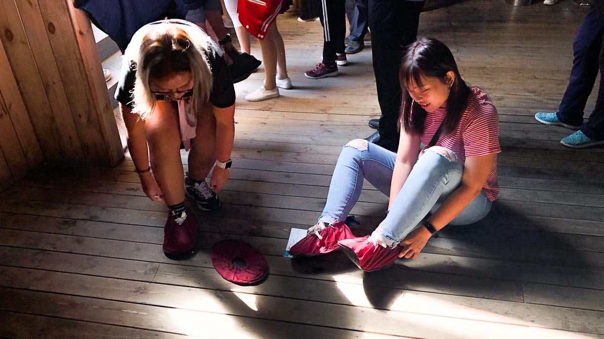 Chloe and Sherry wearing shoe covers at Zhangjiajie - Things to do in Wuhan - Central China Itinerary