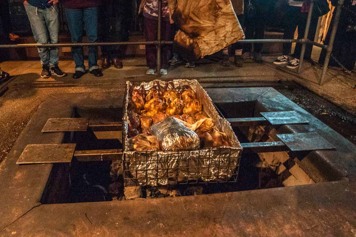 Hangi Cooking in Underground Pit at Mitai Maori Village - New Zealand Best Things to Do