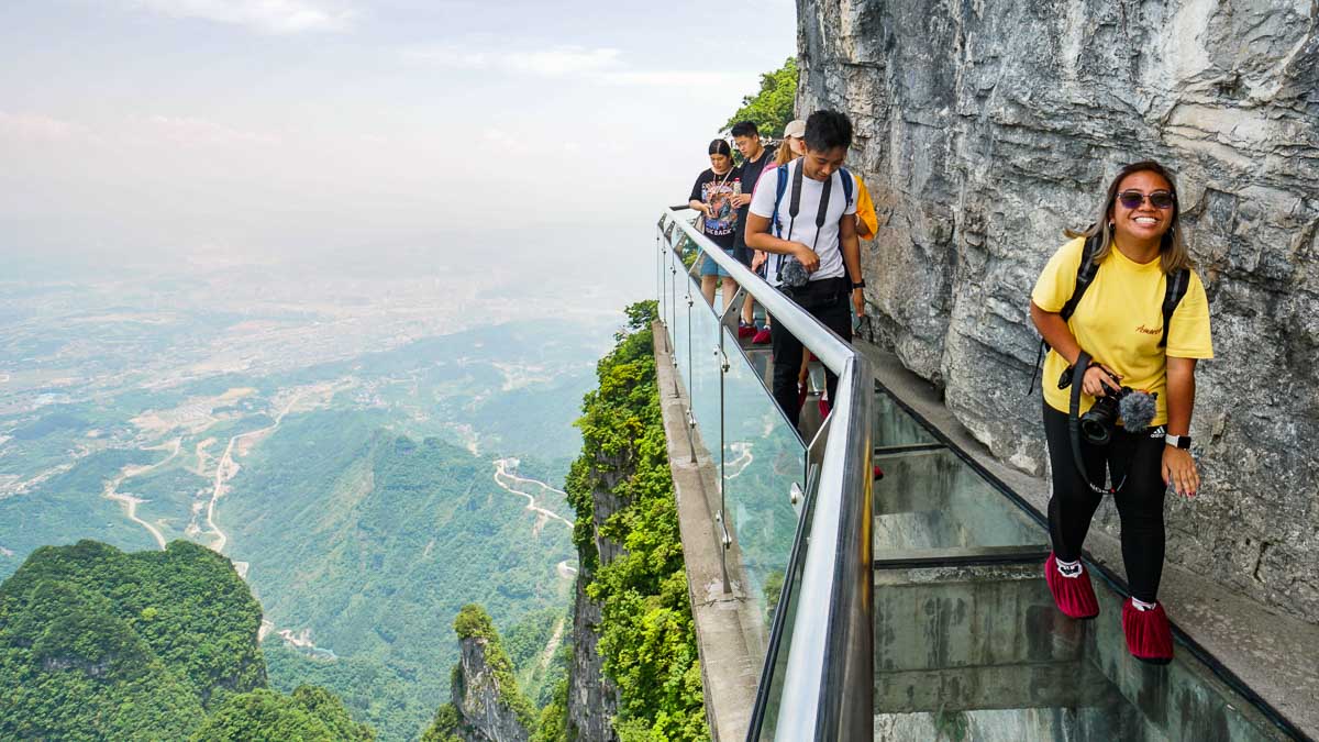 Nervous faces on Tianmen Mountain Cliffside Glass Bridge - Things to do in Wuhan - Central China Itinerary